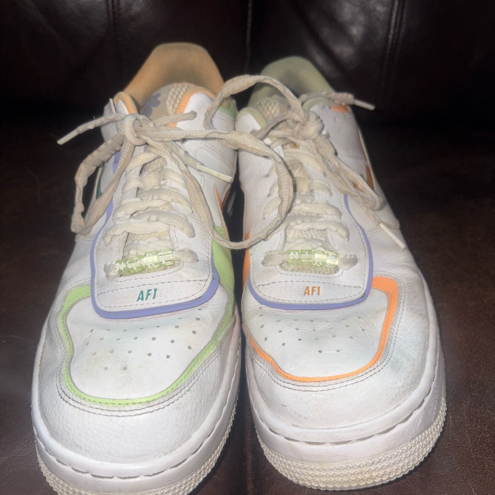 Nike White Low-Top Sneakers with Green, Orange & Purple Trim